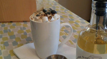 toasty marshmallows on top of graham cracker hot chocolate